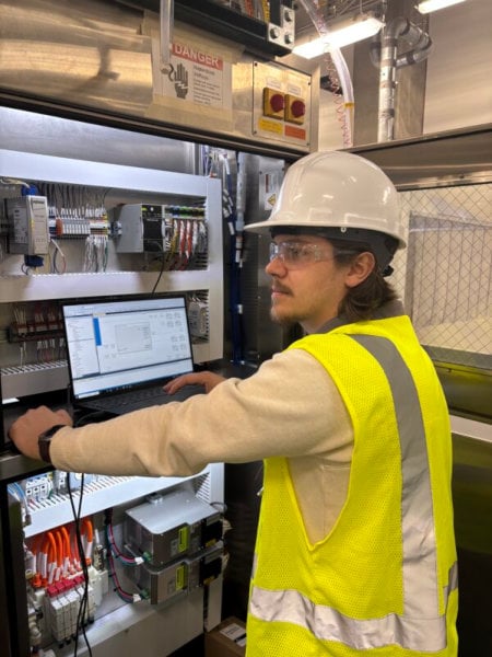 man standing in front of automation control technology