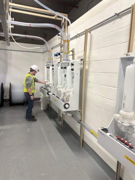 man standing in front of automation control technology